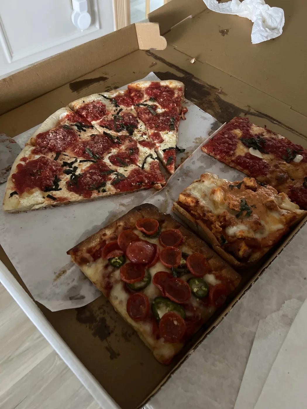 Square pies in a Rosa's Pizza box