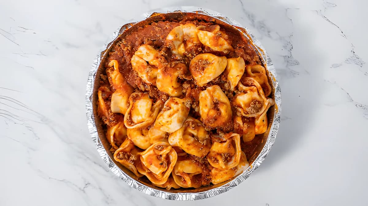 A tray of pasta in sauce