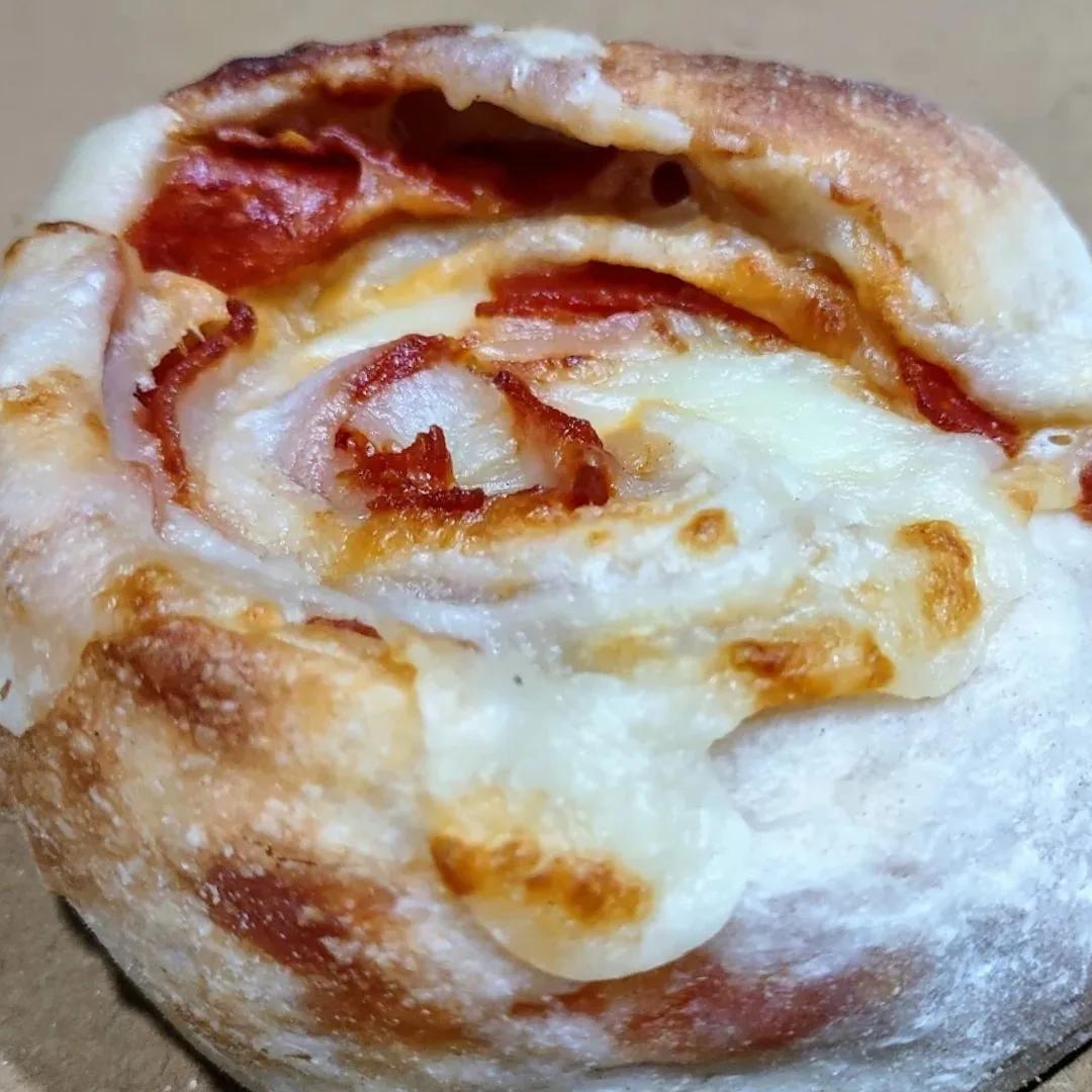A Rosa's Pizza pepperoni roll, hot and fresh