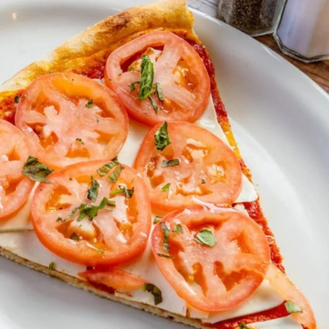 Fresh tomato slice at Rosa's Pizza