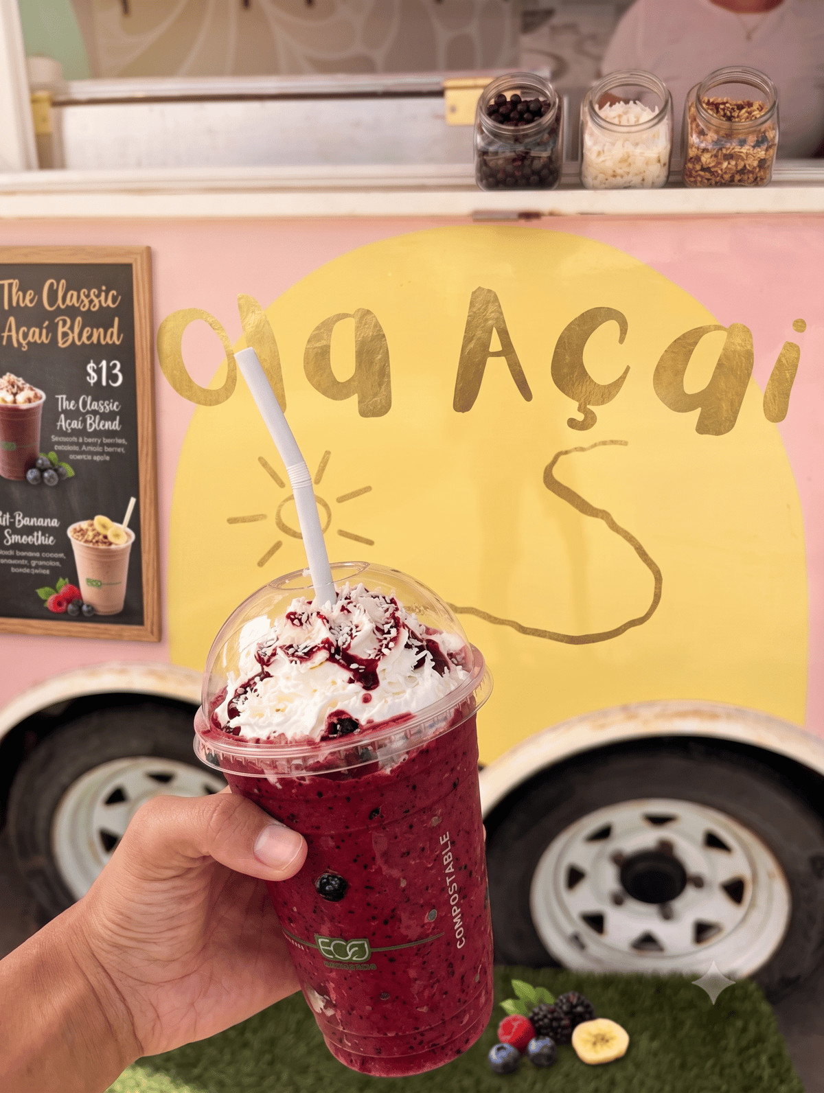 A berry smoothie in front of the Wai Ola Acai Bar truck