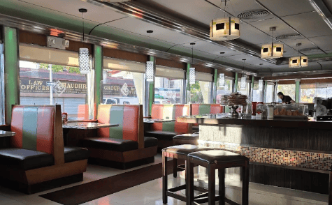 Booths and counter stools inside Classic Diner