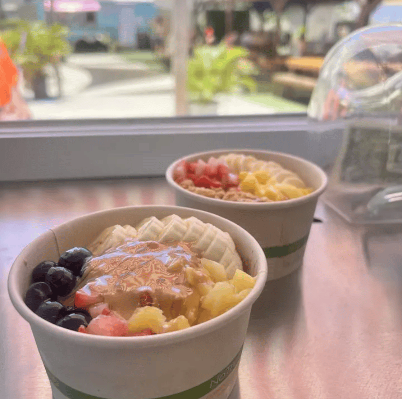 Açaí bowls topped with fresh fruit at Wai Ola Acai Bar