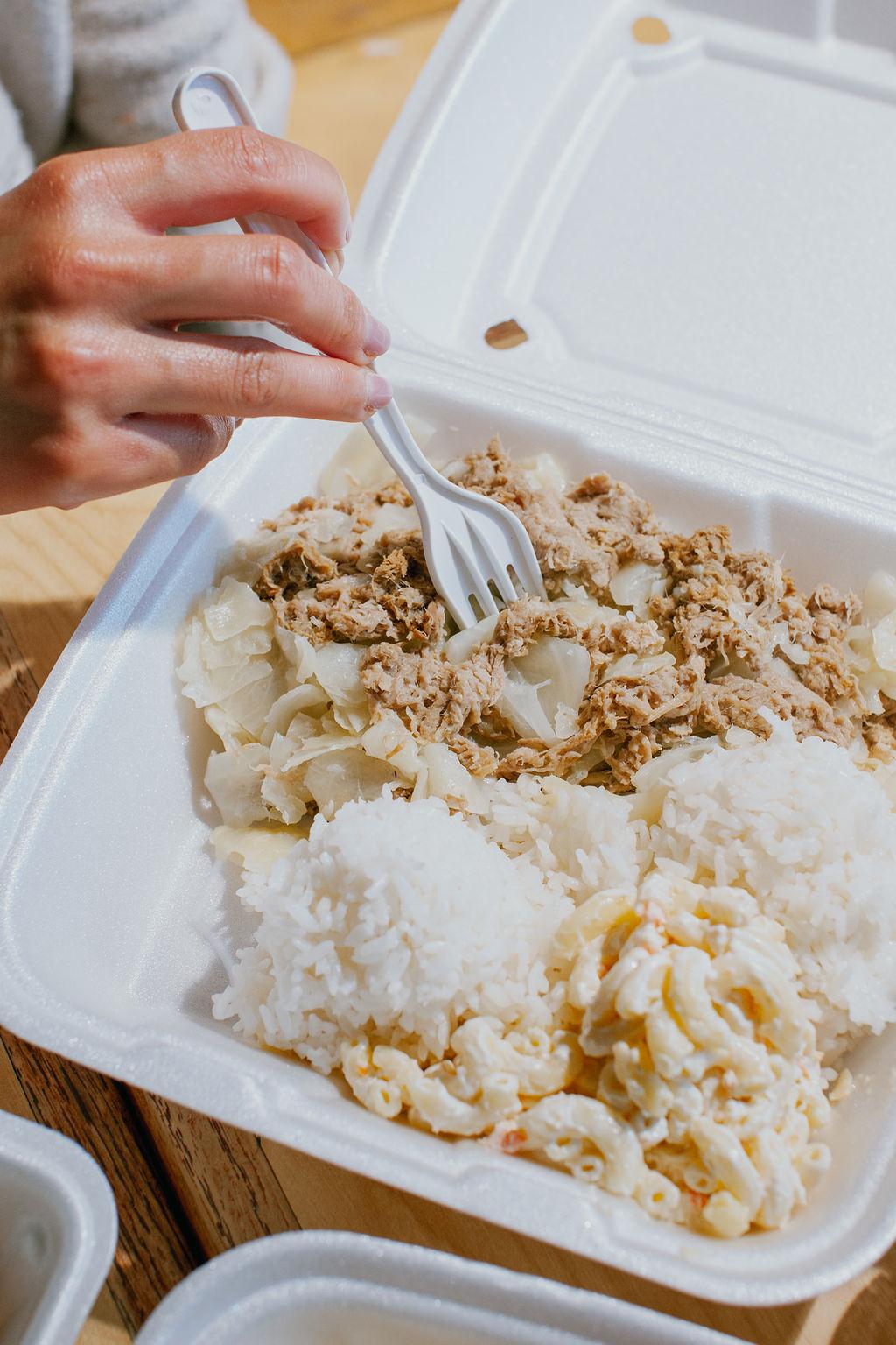 Plate lunch with rice, macaroni salad and ground meat with cabbage