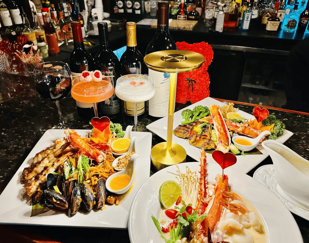 Seafood platters with crab legs and mussels, and cocktails at the bar