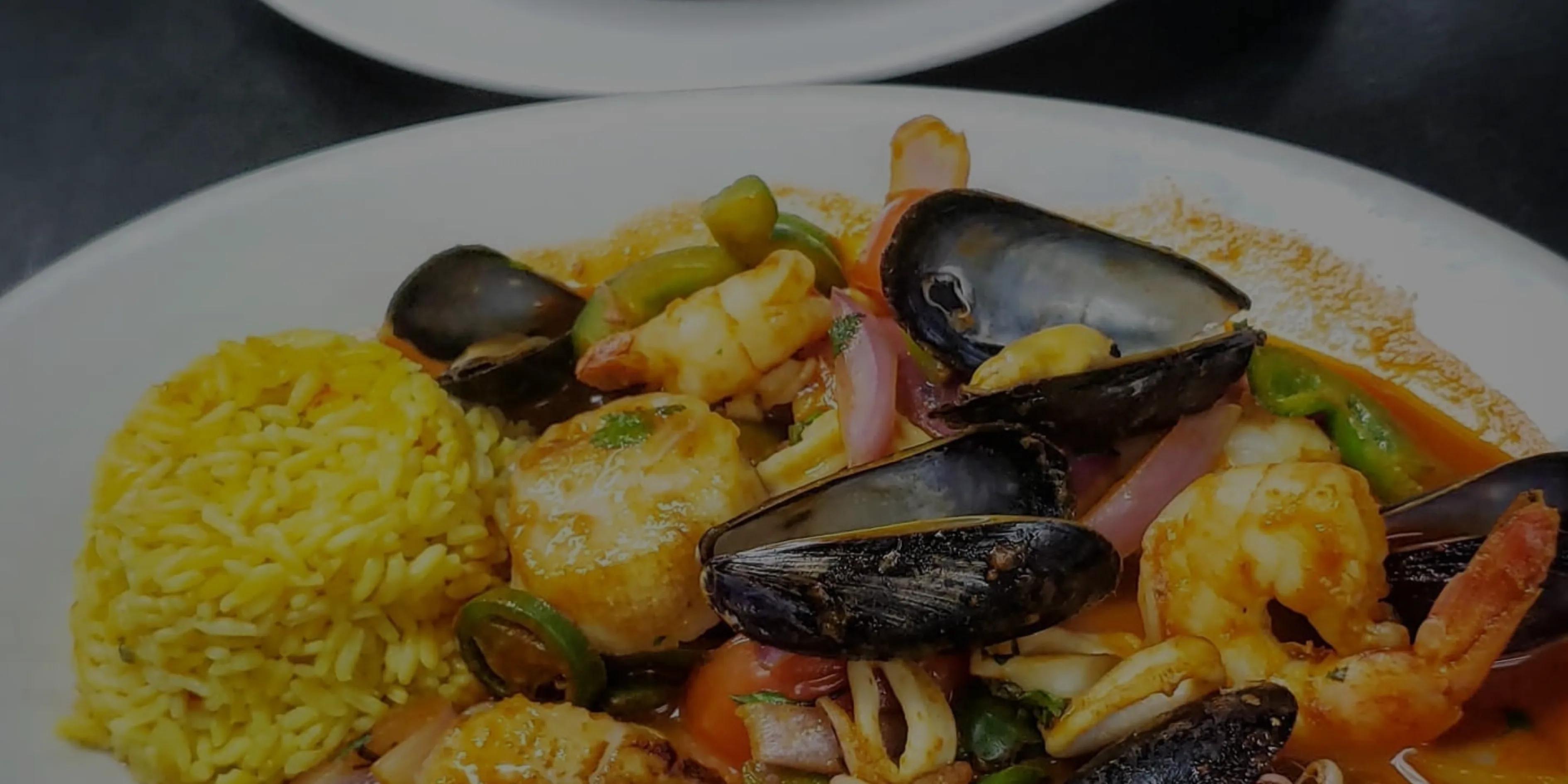 Seafood paella with mussels and saffron rice