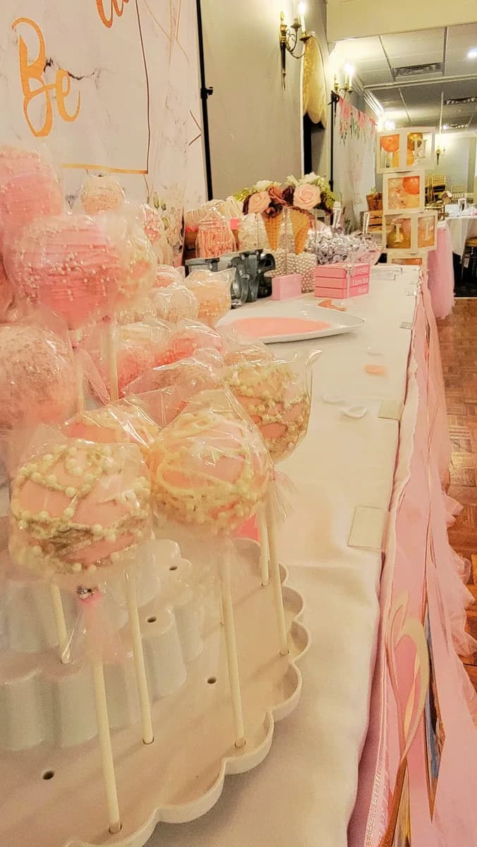 Pink cake pops at a bridal shower