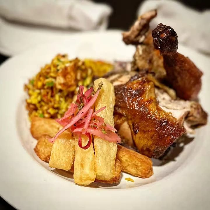 Roasted chicken with yuca fries and pickled onion
