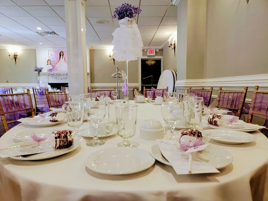 Round tables set with blue napkins